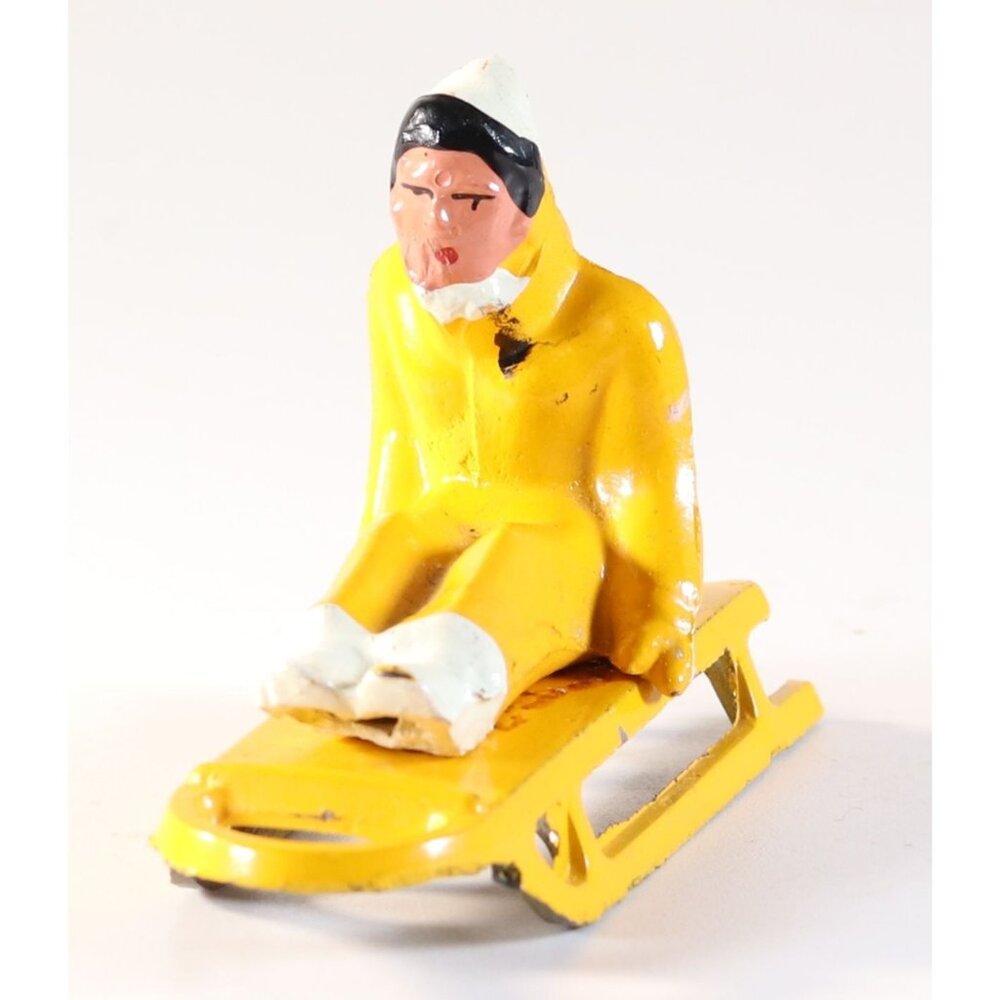 Britain Man Riding Sled Lead Figure 1950s Vintage Lead Toy 2" Tall